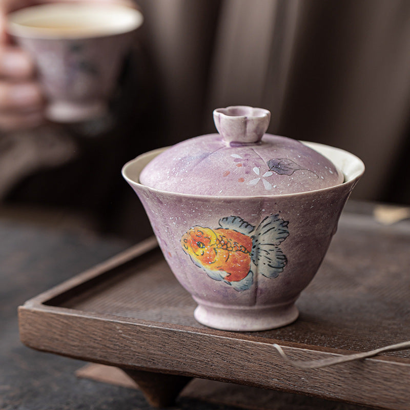 Ladies cover bowl purple tea cup ceramic is not hot, household high-end tea set under glaze hand-painted national style goldfish gift